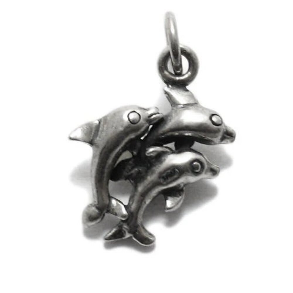 DOLPHINS IN MID-JUMP CHARM IN 3D STERLING SILVER.